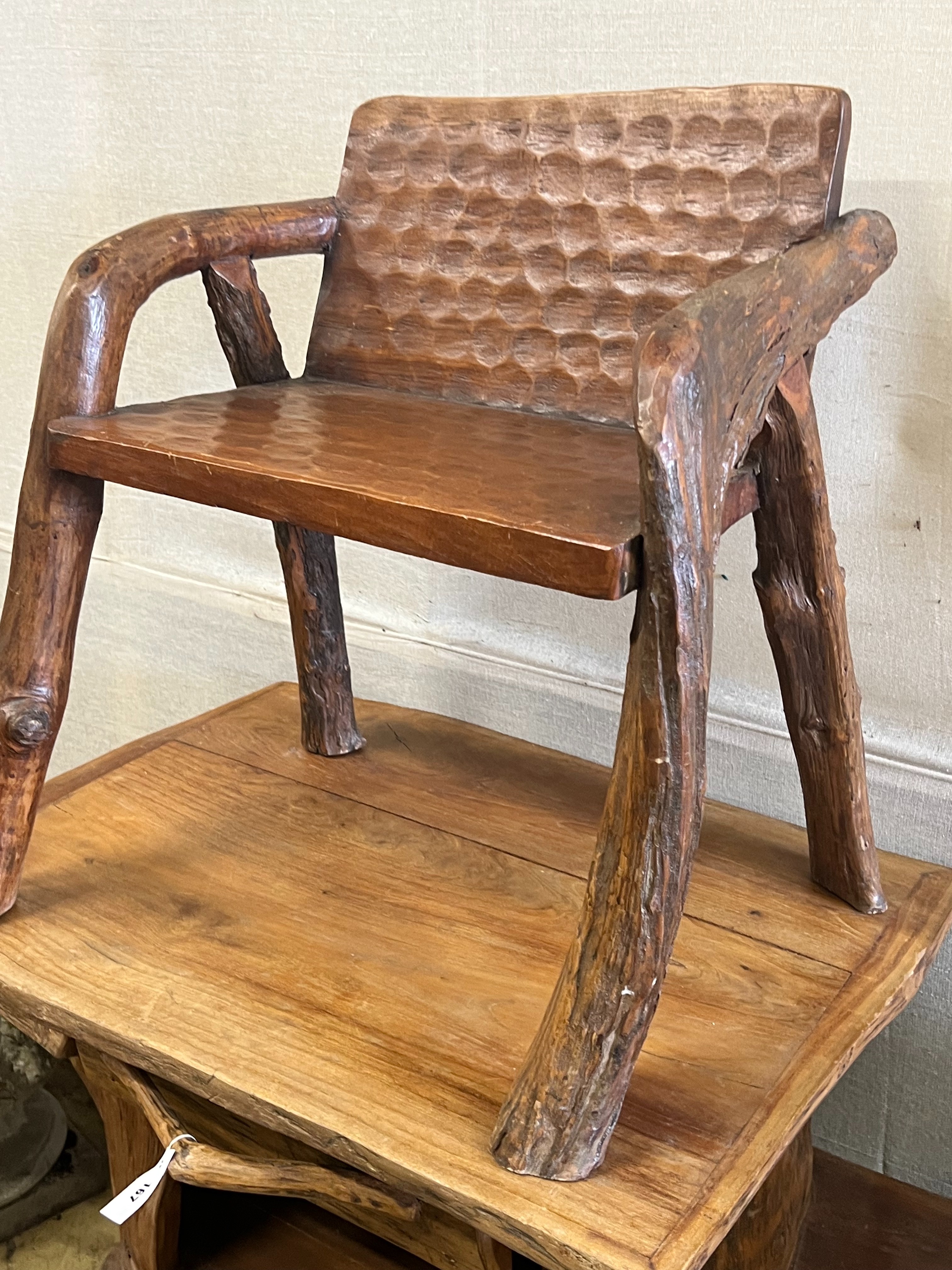 A rustic fruitwood side table and chair, table width 148cm depth 62cm height 81cm